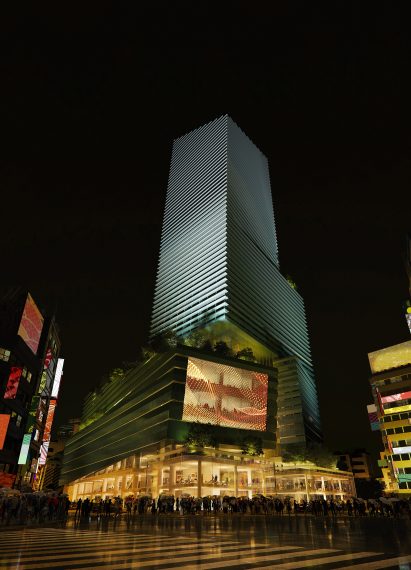Exterior of Snøhetta's Shibuya Upper West Project tower in Tokyo lit up at night