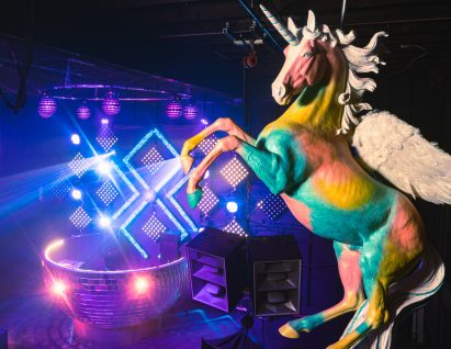 Unicorn sculpture above stage