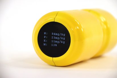 Small circualr LCD screen on the top of the soil monitor shows four sets of numbers prefixed by the initials N, P, K and M