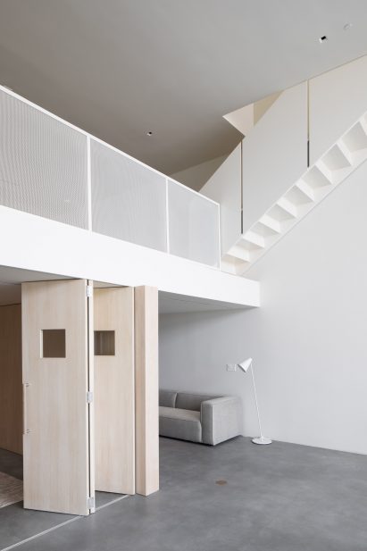 Accordion doors under mezzanine