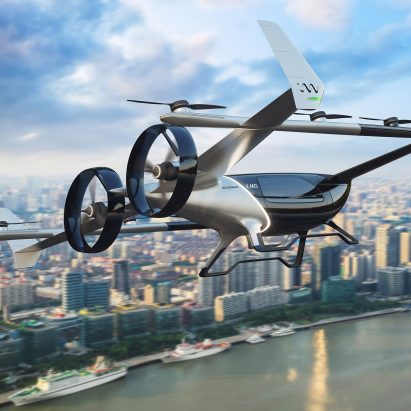 A flying car hovering above a river