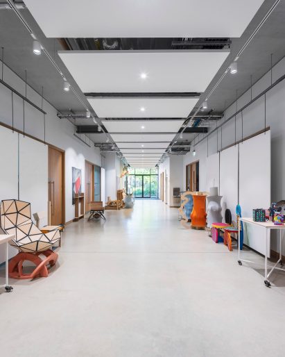 Interior image of a greyscale corridor at The Dyson Building at Gresham's School