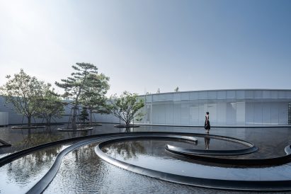 Curved water feature in museum complex in China