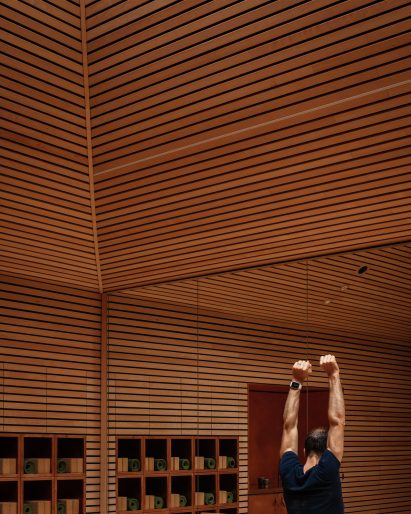 Yoga studio with beech-lined walls