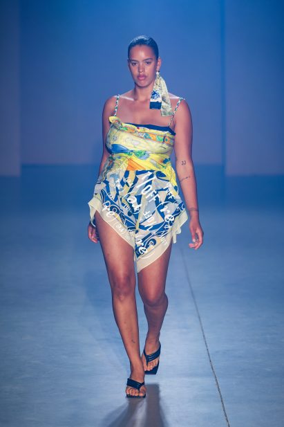 A model is pictured wearing a dress made from vintage scarves by 1/OFF