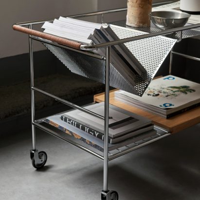Details of metal trolley with design magazines on top