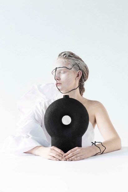 Woman holding ceramic design