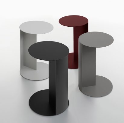 Photograph showing side tables positioned on a white backdrop