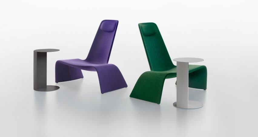 Photograph showing side tables positioned on a white backdrop with lounge chairs
