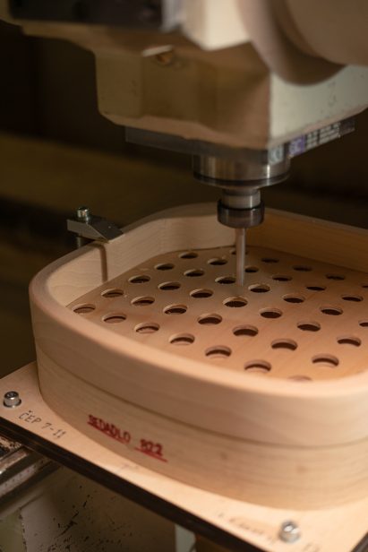 Machine perforating the 822 collection wooden