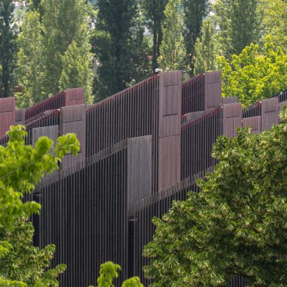 Image of building surrounded by trees