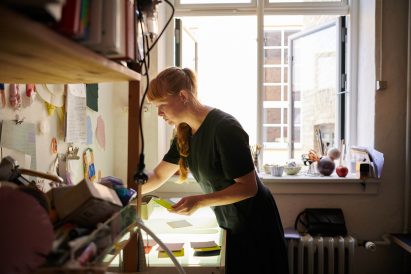 A photograph of a designer at work