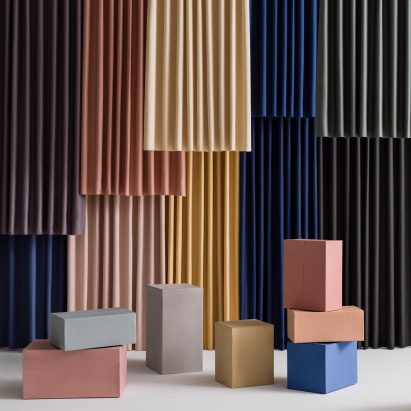 Different coloured Billow fabric hanging in a showroom space