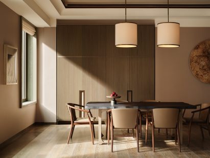 A dining table surrounded by chairs is a minimally designed room