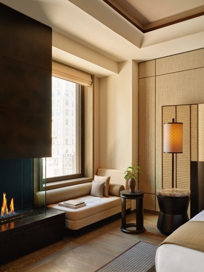 Guest suite with beige walls and a daybed next to a window