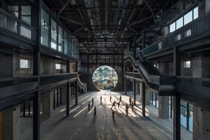 Community hub with moon gate-style wall by ARCity Office