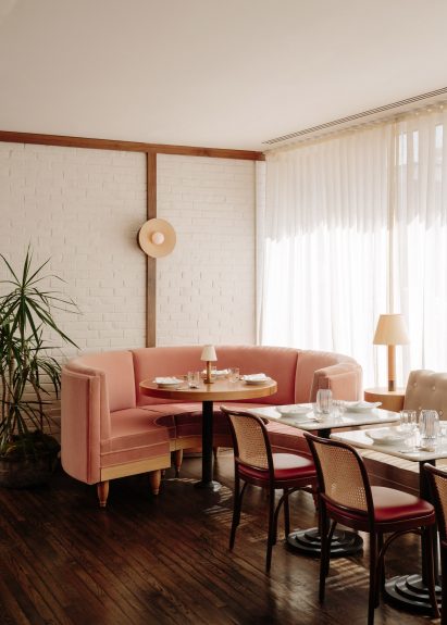 Curved pink booth in a corner