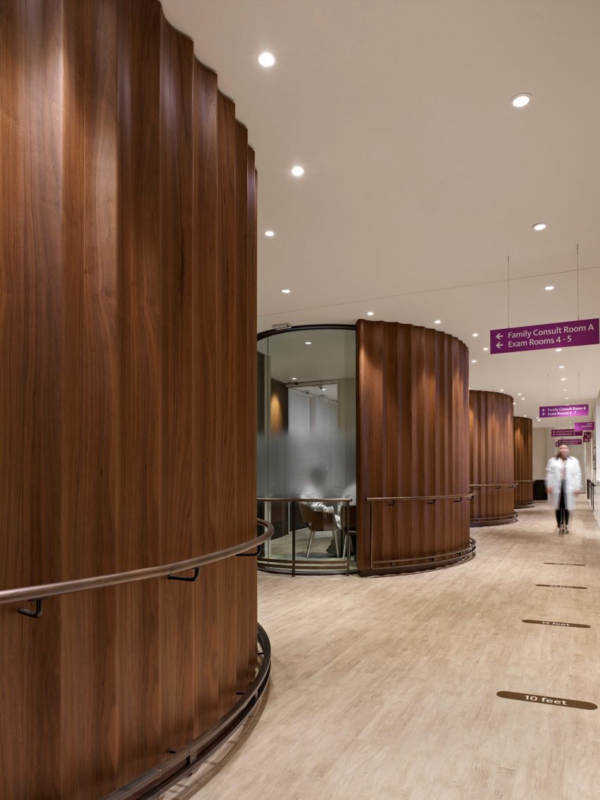 Walnut cladding around consultation rooms