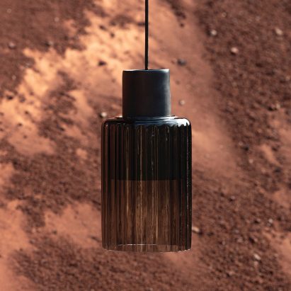 Photograph of a black ceiling lamp using clay and glass materials