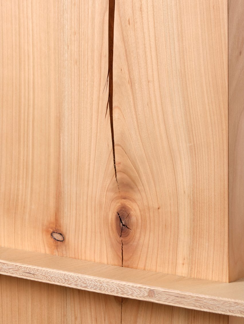 Photograph showing detail of raw cherry wood with split and knots in wood grain