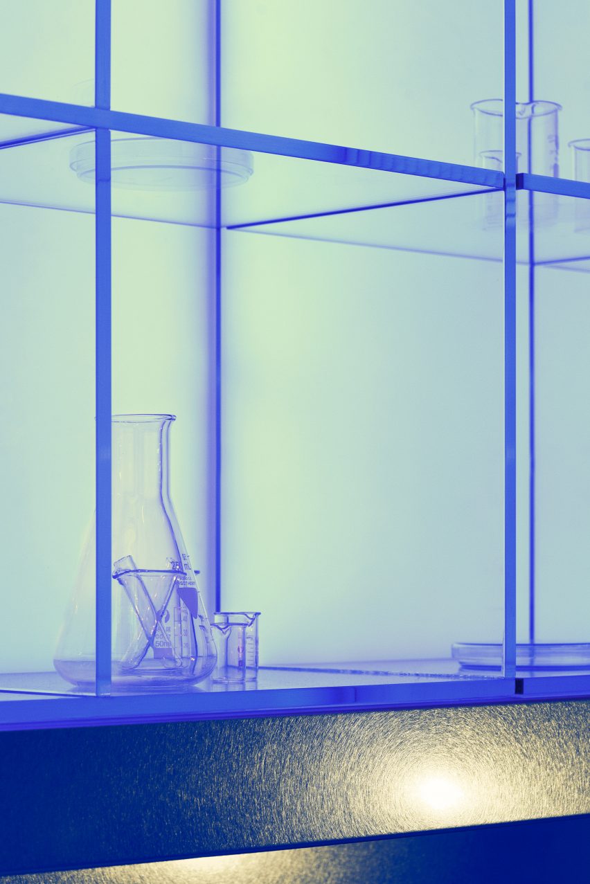 Biotherm concept store in Monaco has blue interiors with science lab-inspired details