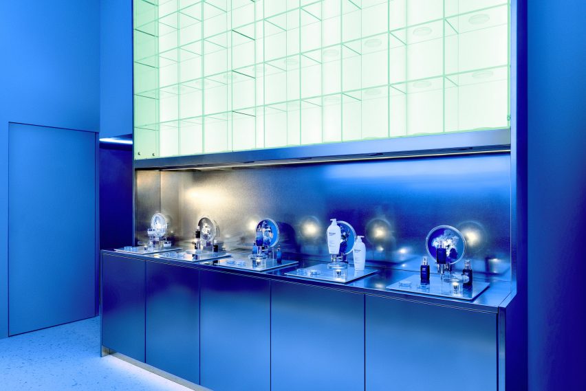 Biotherm concept store in Monaco has blue interiors with science lab-inspired details