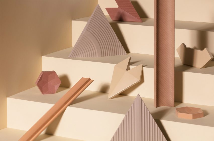 Triangle, rectangle, hexagon and geometric Cavaril tiles in sandy and clay-toned colours placed on yellow steps