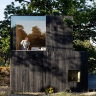 Facade with black-painted timber cladding