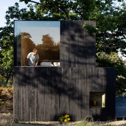 Facade with black-painted timber cladding