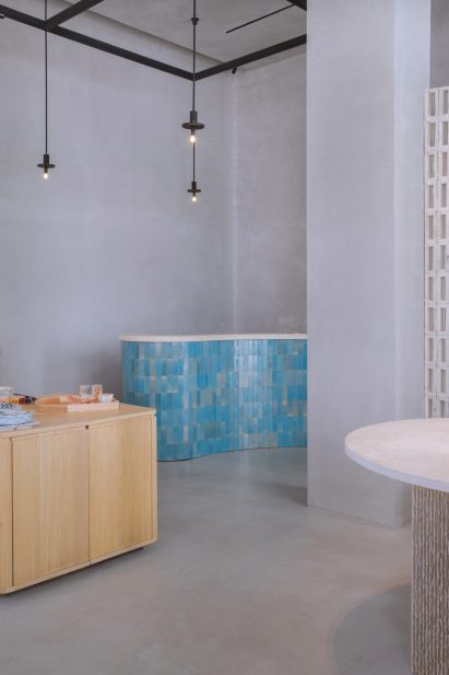 Sales counter clad in blue tiles