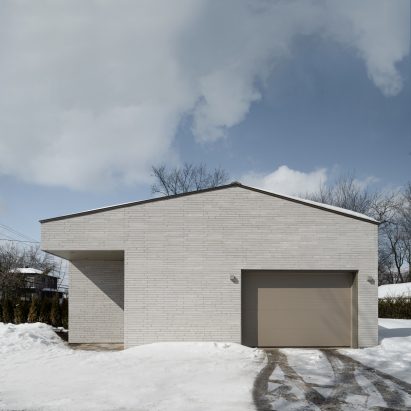 Grey brick clad home Montreal