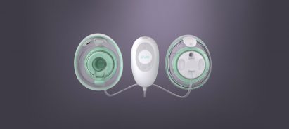 A white and green Elvie Stride breast pump