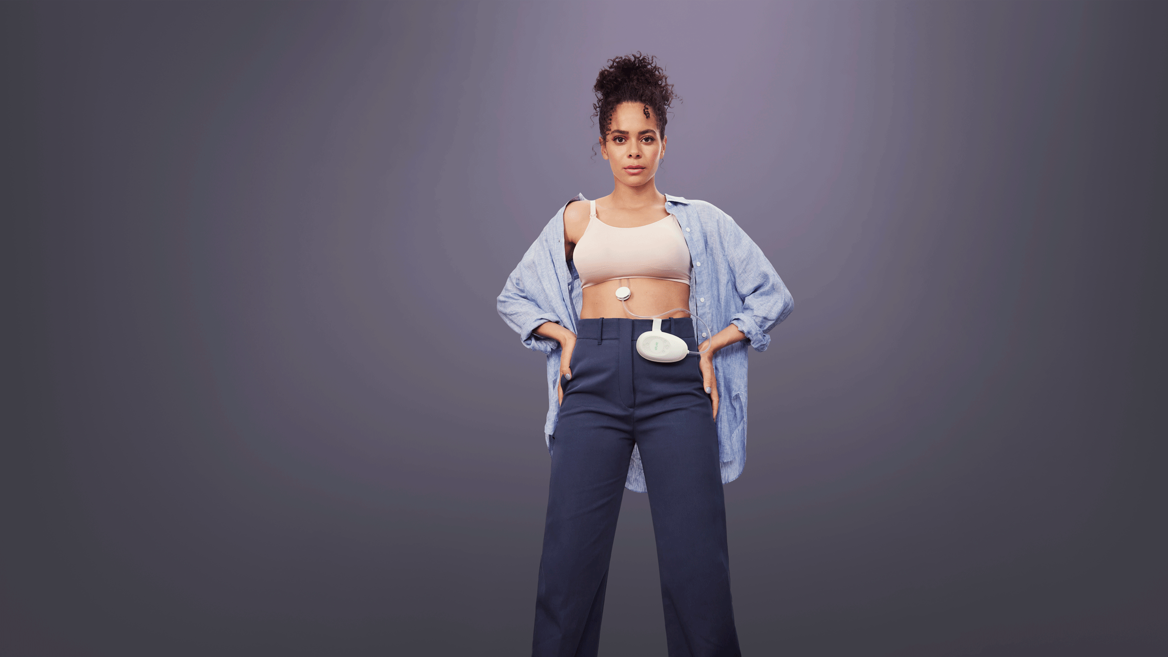A woman wearing a hands-free breastpump