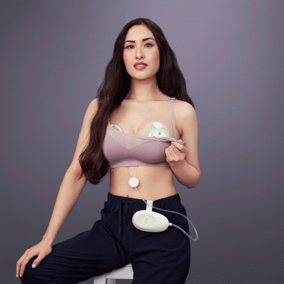 A woman wearing an Elvie breastpump