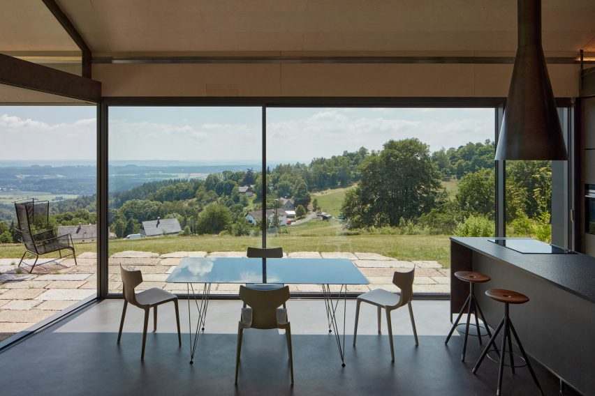 Photograph showing dining area with large windows