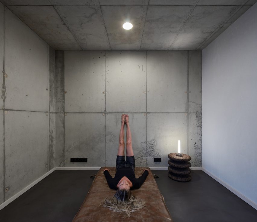 Photograph showing person on low floor cushion stretching