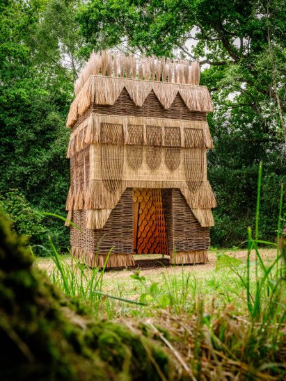 Thatch and wooden pavilion by Flea Folly Architects