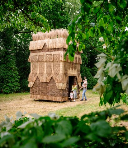 False Banana Pavilion by Flea Folly Architects in Sussex garden clearing