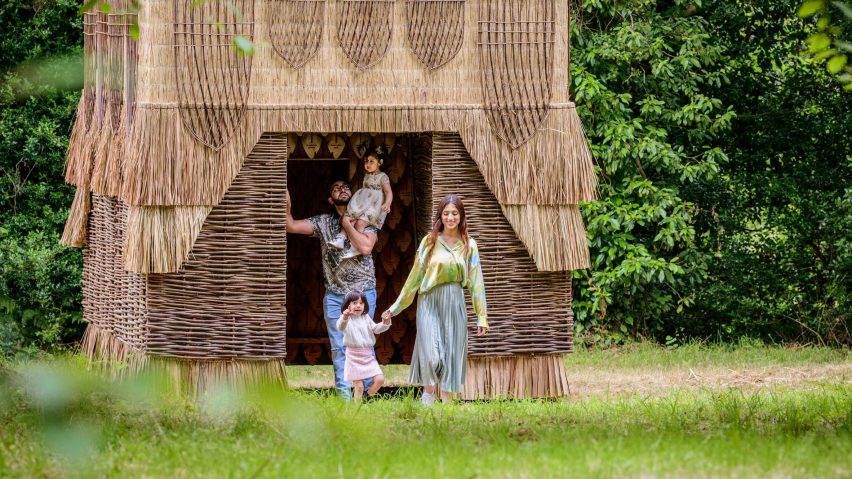 People walking out of the False Banana Pavilion at Kew Wakehurst