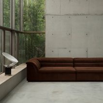 Float sofa by Sarah Ellison in a concrete interior