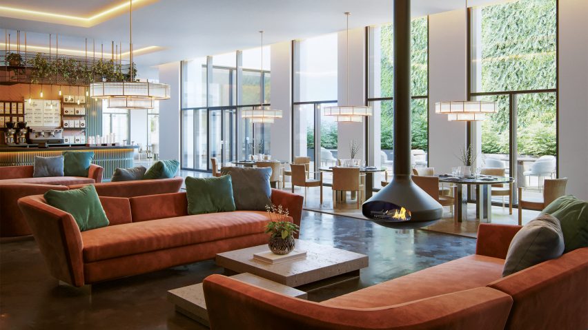 Focus fireplace in an open living room with red sofas