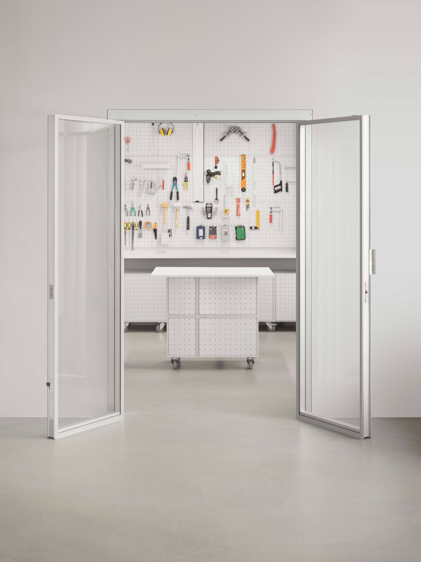 White wall with door that opens up to workshop