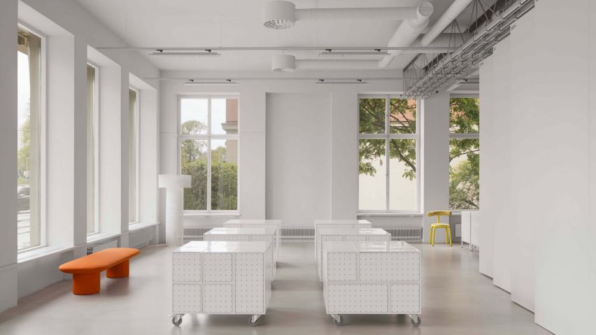White design studio interior with wheeled storage cabins by Form Us With Love