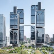 Pair of skyscrapers connected by suspension bridge