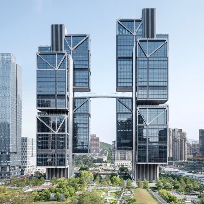 Pair of skyscrapers connected by suspension bridge