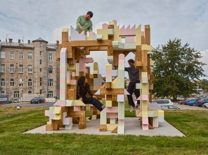 Iheartblob climbing the Fungible Non-Fungible Pavilion in Tallinn