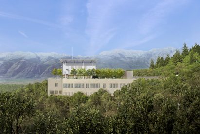 Visual of the General Hospital of Sparta emerging from treetops