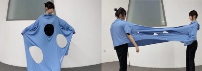 Model wearing a blue garment with large holes in