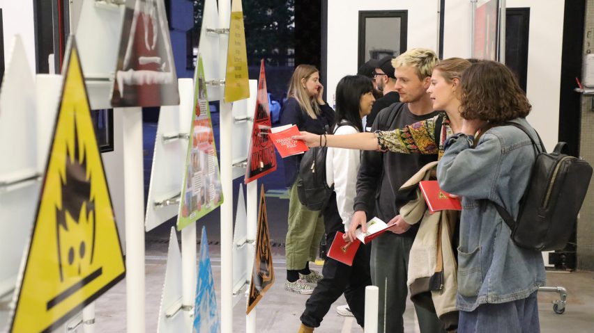 Graphic reinterpretations of the fire safety sign on display at The Running Towards exhibition