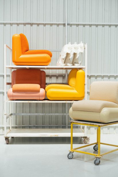 Four colourful chairs in a storage unit